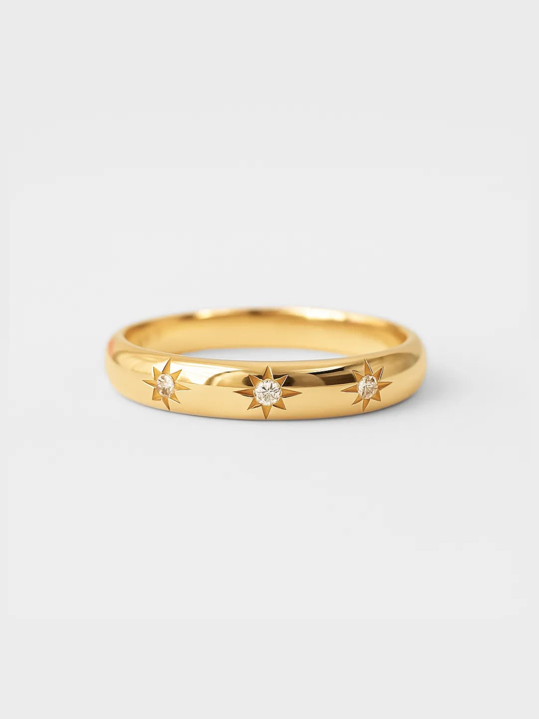 18k solid gold bezel ring featuring three star diamonds by PETRALO