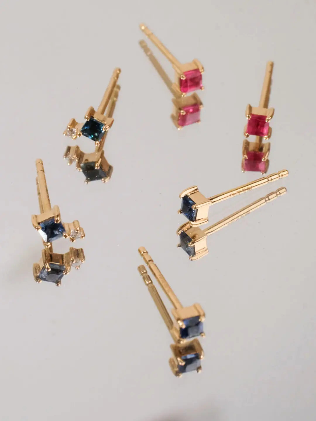 tiny square earrings in solid gold