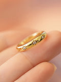 three star diamond 14k Gold ring with diamond accents on a finger by PETRALO